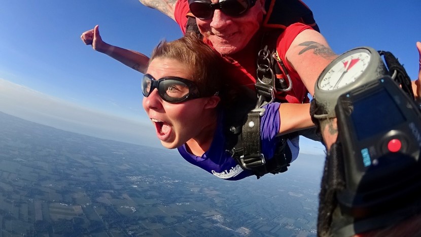 Kaila Proux and her tandem skydiving instructor in mid-flight