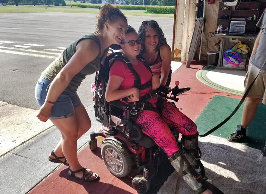 Paraplegic skydiver Naomi gets prepared for her birthday skydive with her sister. 