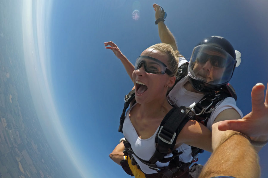 Tandem student in skydiving freefall.