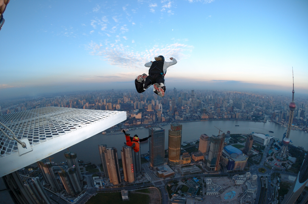 base jumpers leaping over a city
