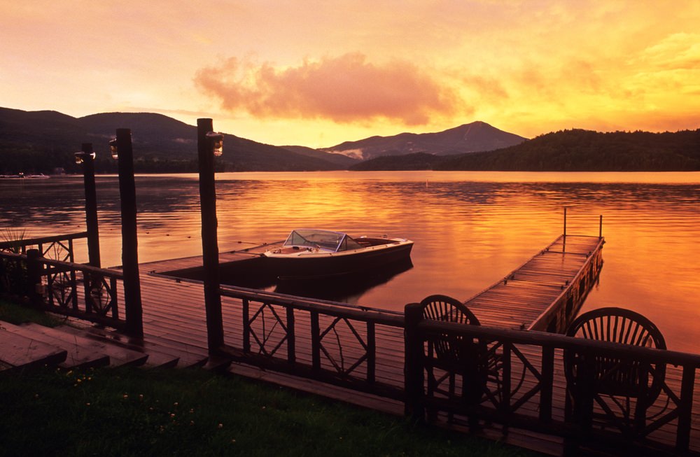 Motor boat moored at pier at dawn, Lake Placid, Adirondack State Park, New York State, United States of America, North America